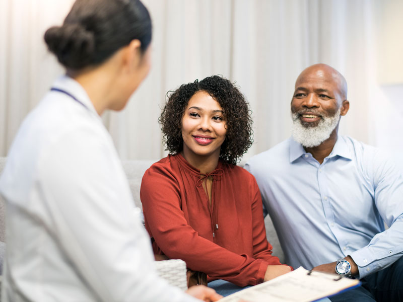 couple talking to doctor